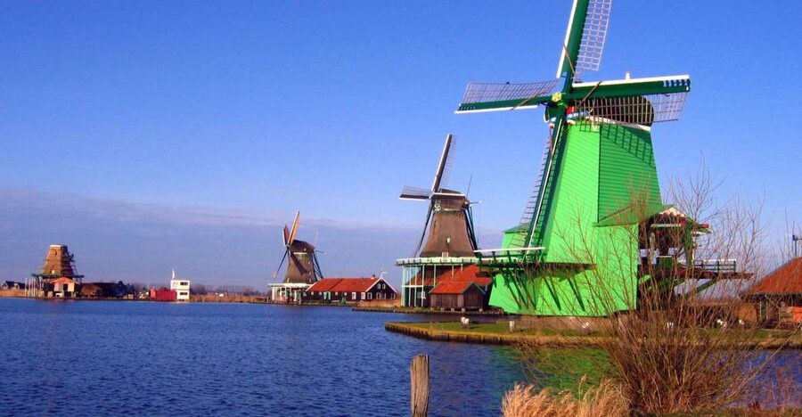 From Amsterdam: Small Group Zaanse Schans and Volendam Tour - Zaanse Schans windmill village: clogs, cheese, and Dutch workshop culture