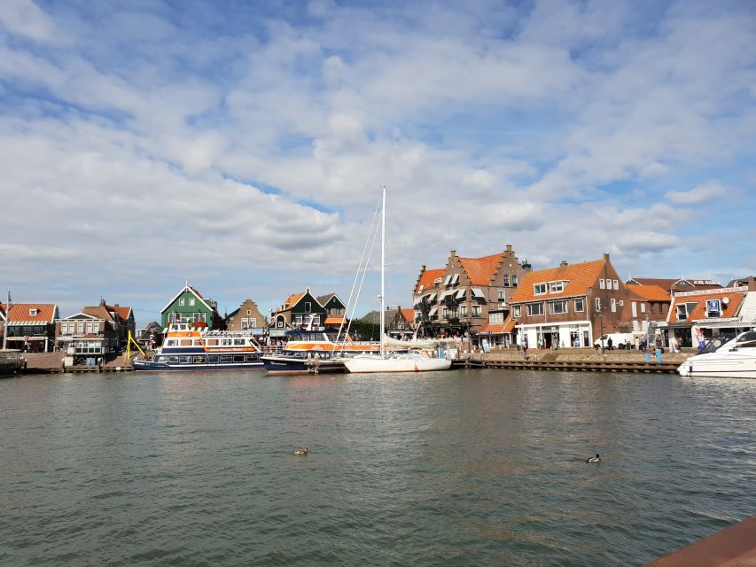 From Amsterdam: Small Group Zaanse Schans and Volendam Tour - Volendam at noon: a guided walk to the old port and regional food