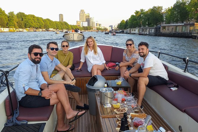 Guided Amsterdam Canal Cruise – Snacks & Drinks on board(1 Hour) - The route: from Amsterdam’s oldest streets to Golden Age elegance