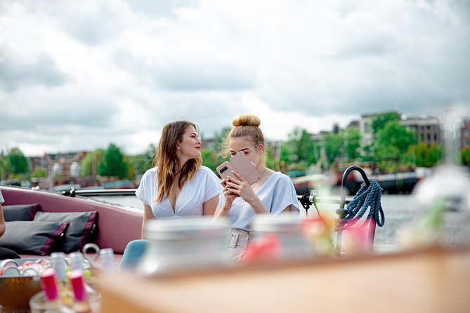 Guided Amsterdam Canal Cruise – Snacks & Drinks on board(1 Hour) - Your guide experience: stories, humor, and named moments