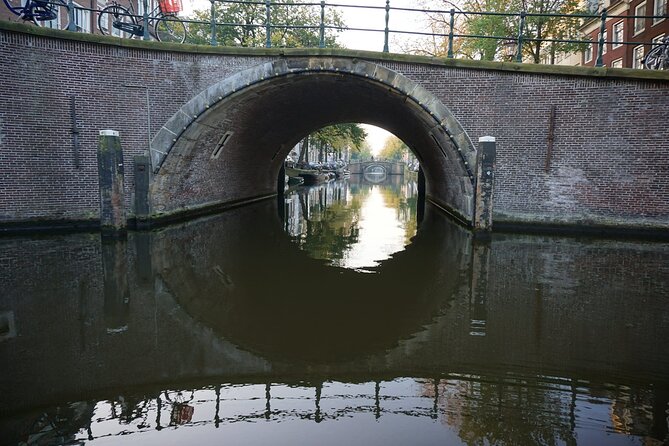 Morning Canal Cruise Amsterdam in Small-Group - What you see: canal houses, bridges, and reflection photography