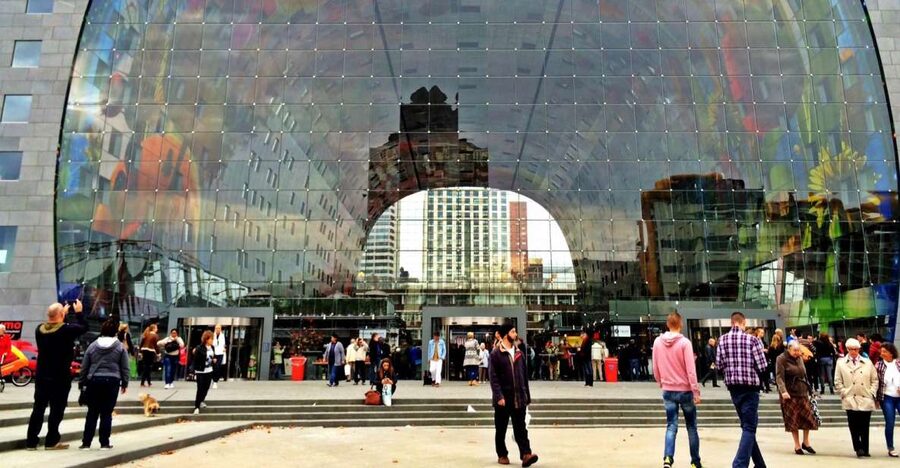 Rotterdam Tour with Cube House Admission - Getting oriented at Rotterdam Central, under the meeting cloud