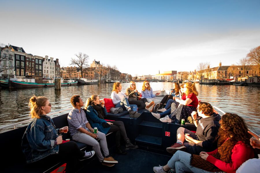 Small-Group Walking Tour with Amsterdam Canal Cruise - The canal cruise: Amstel views, seven bridges, and two cruise options